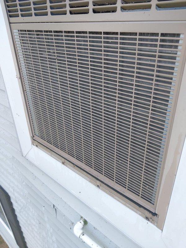Responded to concern regarding utility company notification about AC unit potentially working inefficiently. Performed system inspection on 12-year-old unit and verified operational status. Confirmed proper airflow and cooling performance at outdoor condenser and indoor air handler. Inspected air filter installation and verified correct filter size for system specifications. Advised customer on proper filter fitment to ensure optimal system efficiency and airflow. Unit operating within normal parameters at time of service.