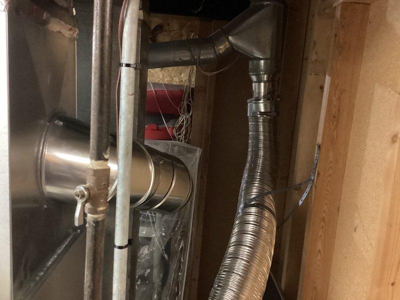 Completed installation of Lennox air conditioning system in basement utility area, including proper integration with existing furnace unit. Connected refrigerant lines, electrical controls with indicator lights, and PVC condensate drainage system, with all ductwork properly insulated and secured. Retrieved customer's portable air conditioning unit and returned it to shop as requested.