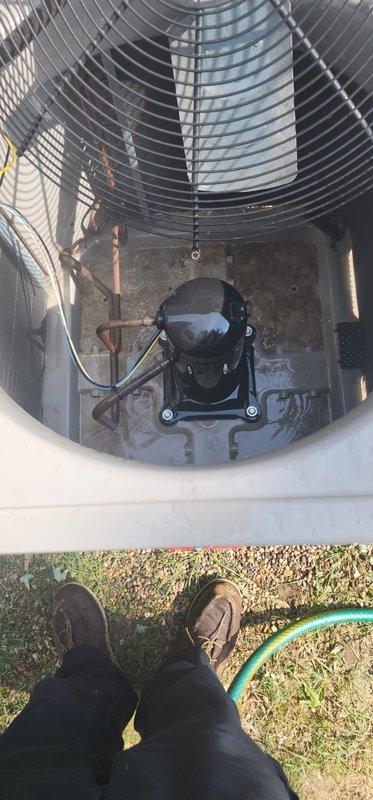 Completed comprehensive AC maintenance on outdoor heat pump unit. Performed visual inspection of condenser coil, fan assembly, compressor, and refrigerant lines. All components found in operational condition with normal outdoor weathering present. Unit exterior cleaned and debris removed from surrounding area to ensure proper airflow and system efficiency.