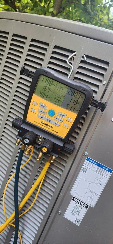 Completed comprehensive AC tune-up and preventative maintenance on 1.5-year-old outdoor condensing unit at commercial facility. Performed refrigerant pressure and temperature diagnostics using digital manifold gauges, verifying system charge levels and operating parameters within manufacturer specifications. Inspected indoor air handler components including condensate drain pan, copper refrigerant lines, and electrical connections. All systems operating normally with no issues identified during inspection.