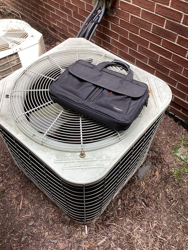 Conducted on-site evaluation for replacement of two 37-year-old furnaces located in basement and two 37-year-old air conditioning condensers positioned outside against brick exterior. All existing equipment currently operational with no reported symptoms or safety concerns. Inspected both outdoor condenser units, documented equipment conditions, and assessed installation locations including electrical disconnects, refrigerant line routing, and clearances. Photographed existing HVAC systems to prepare comprehensive replacement proposals including both standard efficiency and high-efficiency equipment options as requested.