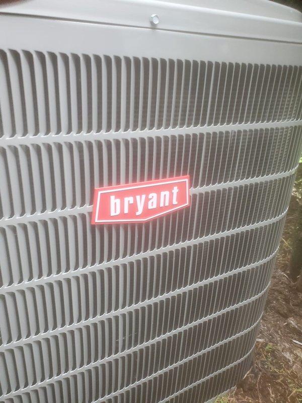 Completed comprehensive preventive maintenance on Bryant brand outdoor air conditioning condenser unit located at rear of property. Performed standard AC tune-up protocol including visual inspection of cabinet and coil fins, which were found to be clean and in excellent condition with no debris accumulation, damage, or corrosion noted. All exterior components including louvered ventilation panels and metal casing showed normal weathering with structural integrity intact and proper airflow capability maintained throughout unit.