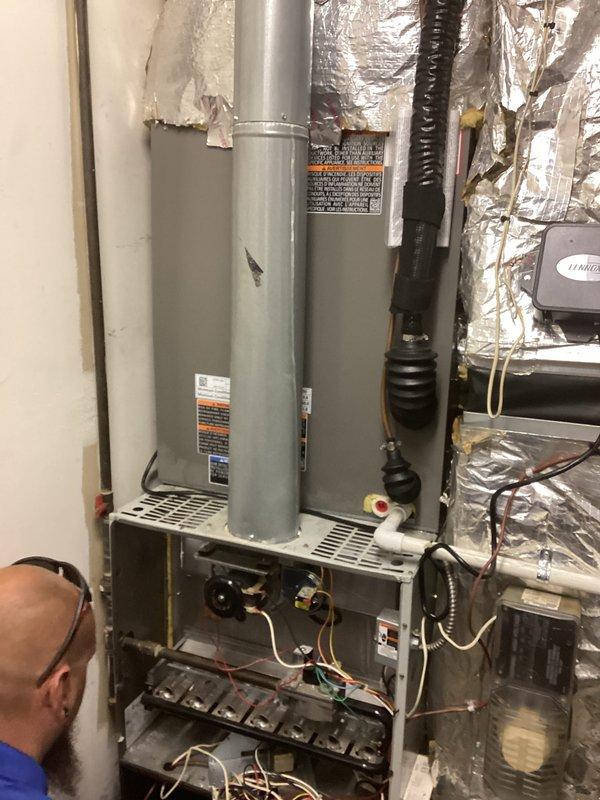 Conducted comprehensive evaluation of existing residential HVAC system for complete equipment replacement estimate. Assessed current gas furnace installation, water heater configuration, and associated ductwork within mechanical closet space. Documented existing equipment specifications, spatial constraints, and installation conditions including reflective insulation barriers and ventilation routing. Photographed furnace interior components, burner assembly, gas connections, electrical wiring, control boards, and overall system layout to develop accurate replacement specifications and scope of work for proposed new equipment installation.