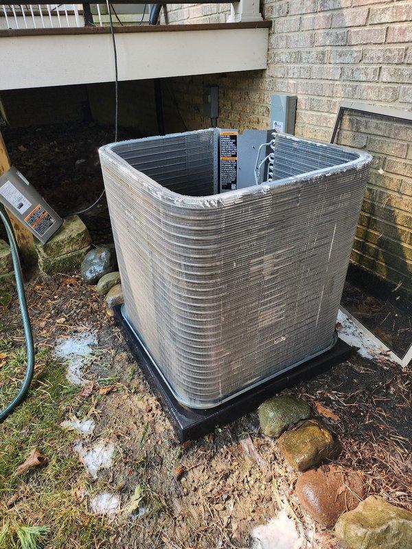 Completed comprehensive maintenance on residential air conditioning system. Performed visual inspection of outdoor condenser unit, verified proper placement on pad, checked electrical disconnect box and wiring connections, and inspected compressor and refrigerant lines for signs of wear or damage. Cleaned condenser coils, verified secure copper line connections, and confirmed all electrical connections were tight and properly configured. System operating within normal parameters upon completion of tune-up service.