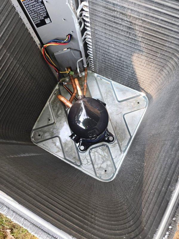 Completed comprehensive maintenance on residential air conditioning system. Performed visual inspection of outdoor condenser unit, verified proper placement on pad, checked electrical disconnect box and wiring connections, and inspected compressor and refrigerant lines for signs of wear or damage. Cleaned condenser coils, verified secure copper line connections, and confirmed all electrical connections were tight and properly configured. System operating within normal parameters upon completion of tune-up service.