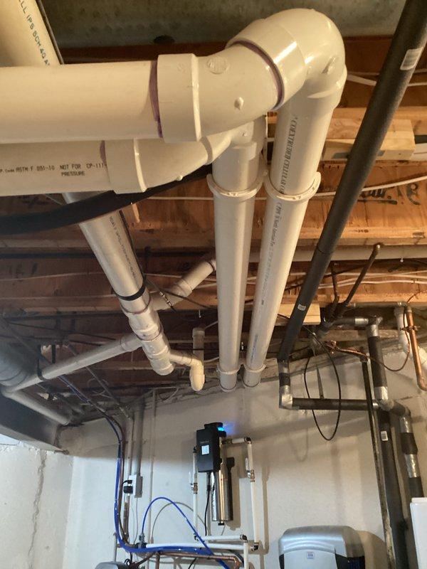 Completed estimate for residential air conditioning system replacement. Unit assessed as 16 years old and found to be low on R-410A refrigerant, indicating potential leak and end of serviceable life. Documented existing outdoor condensing unit and indoor mechanical equipment installation, photographed current system configuration including electrical disconnect and refrigerant line routing for replacement specifications.