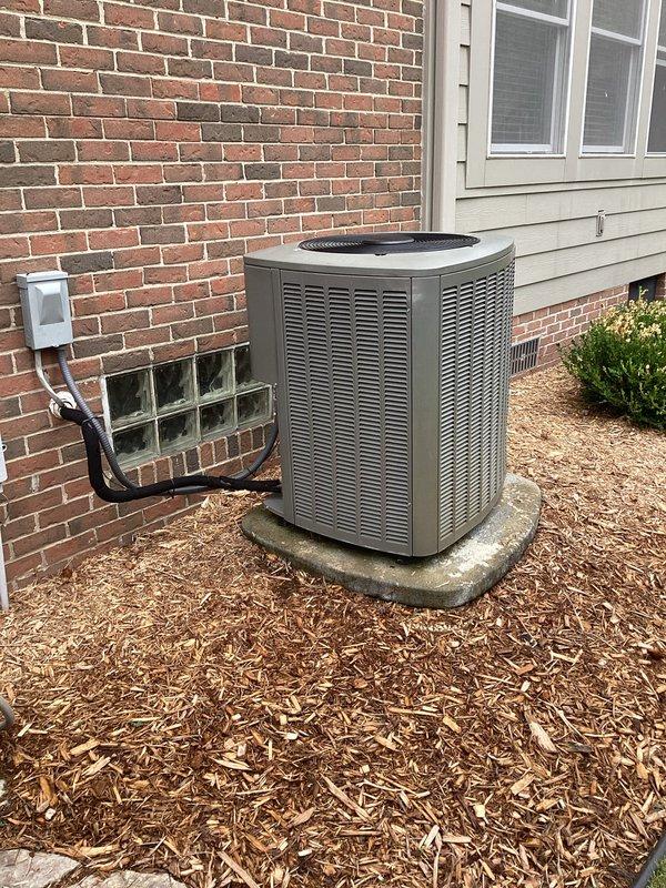 Conducted comprehensive estimate for complete HVAC system replacement on 14-year-old residential air conditioning unit experiencing refrigerant loss. System evaluation revealed low refrigerant levels (2-3 pounds deficient), indicating potential leak or age-related component failure. Documented existing outdoor condensing unit positioned on concrete pad with proper electrical disconnect and existing indoor air handler with associated ductwork and refrigerant line configuration. Photographed current installation including exterior unit placement, electrical connections, and complete indoor mechanical room setup showing existing ductwork, refrigerant lines, electrical panel access, and condensate drainage system to support replacement specifications and equipment sizing recommendations.