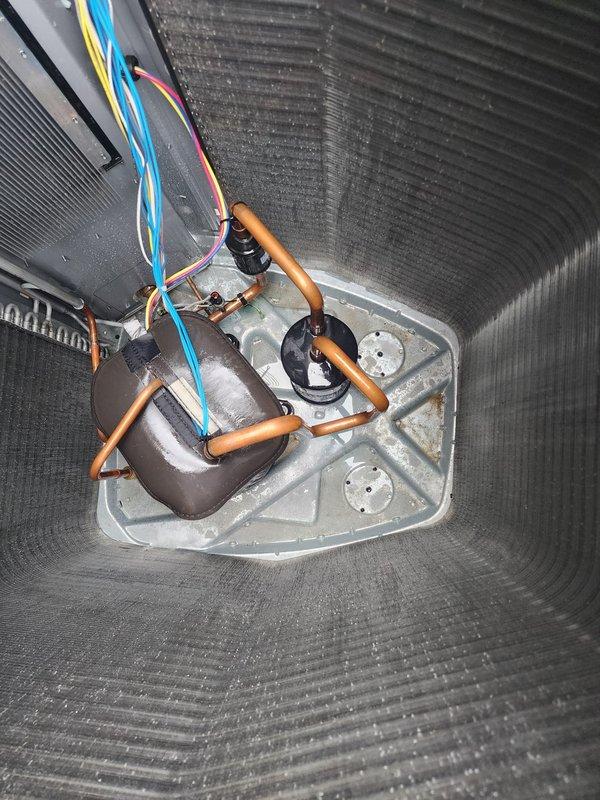 Completed scheduled cooling season preventive maintenance on residential split system air conditioning unit. Performed comprehensive inspection of outdoor condenser unit and indoor air handler, including examination of evaporator coil assembly, condensate drain pan, and drainage system components. Verified proper operation of all electrical connections, refrigerant lines, and condensate removal equipment. Unit tested and operating within normal parameters.