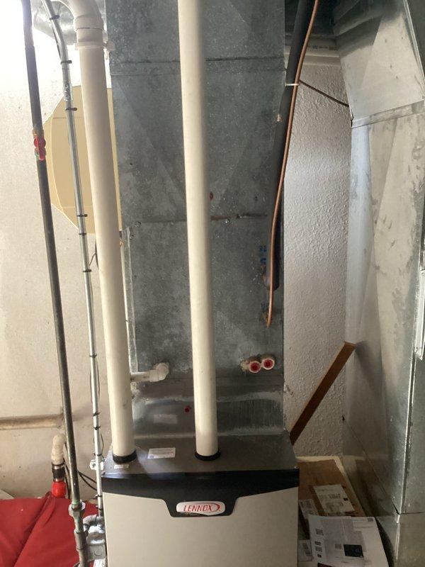 Completed comprehensive HVAC estimate for two-system air conditioning replacement, with primary focus on upstairs unit requiring complete installation. Documented existing basement mechanical equipment including Lennox furnace, humidifier, and associated ductwork and plumbing infrastructure to assess integration requirements for new AC systems.