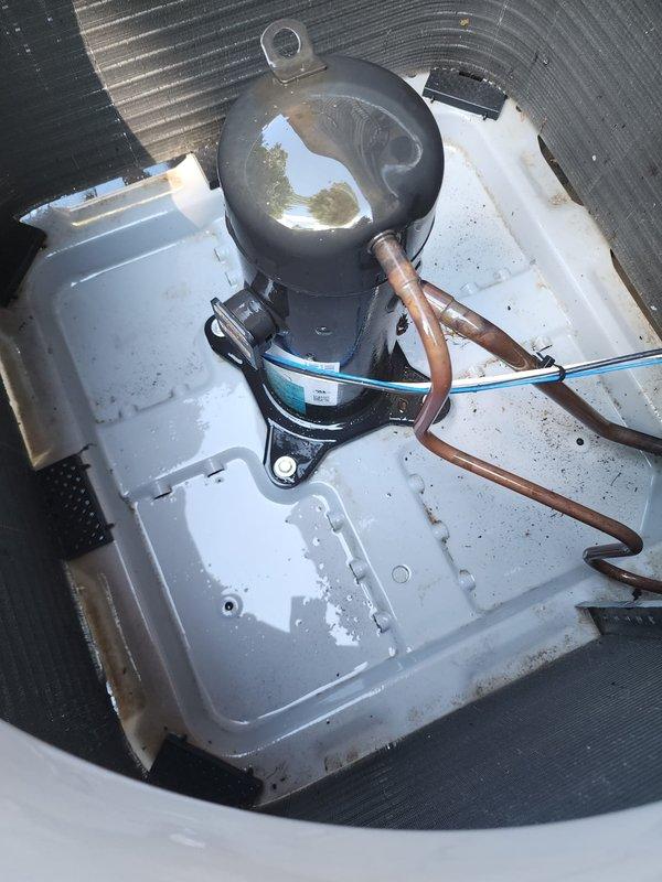 Completed routine cooling season maintenance on residential air conditioning system. Performed comprehensive inspection of outdoor condenser unit, verifying proper operation of compressor, checking refrigerant line connections, and examining condenser coil fins for cleanliness and damage. Condenser coils found in good condition with minimal debris accumulation. Indoor evaporator components inspected, including compressor housing and drain pan, which showed normal operational wear. All system components operating within manufacturer specifications with no immediate service needs identified.