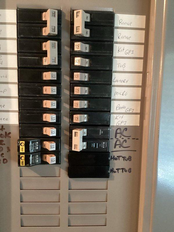 Replaced defective double-pole circuit breaker in main electrical panel with new 10-12 amp breaker. Verified proper installation, secure wire connections, and panel functionality upon completion with photographic documentation of before and after conditions.