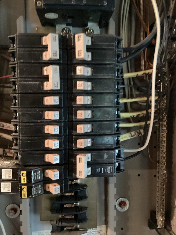 Replaced defective double-pole circuit breaker in main electrical panel with new 10-12 amp breaker. Verified proper installation, secure wire connections, and panel functionality upon completion with photographic documentation of before and after conditions.