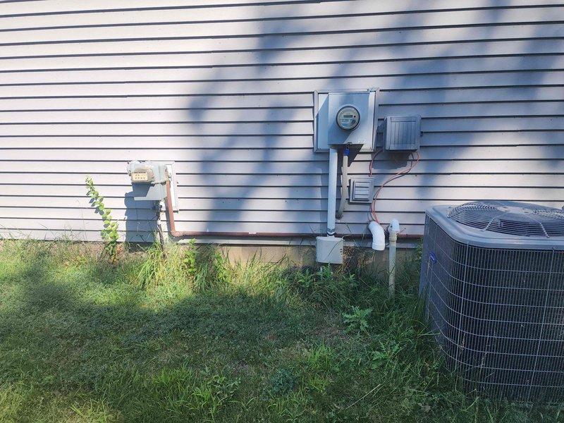 Conducted comprehensive site evaluation for standby generator installation at residential property. Assessed existing electrical service including main breaker panel location in utility area and exterior meter configuration with associated conduit routing. Documented current electrical infrastructure, service entrance equipment, and available space for generator placement adjacent to existing HVAC condenser unit. Provided estimate for automatic transfer switch integration with existing 200-amp service panel and recommended generator sizing based on load requirements.