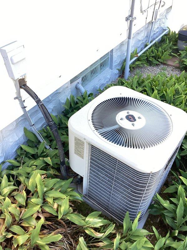 Completed comprehensive estimate for whole-house HVAC system replacement including 25-year-old furnace located in basement and 25-year-old air conditioning unit positioned outside near back door. Both units currently operational but have reached end of expected service life. Documented existing equipment configuration, ductwork connections, and installation conditions with photographic evidence for replacement planning.