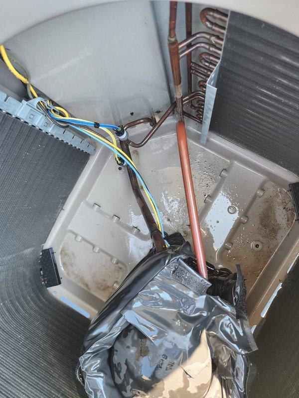 Completed scheduled AC maintenance on residential split system. Inspected outdoor condenser unit, noting accumulated debris on coil fins and surrounding base area. Examined indoor air handler components including evaporator coils, refrigerant lines, electrical connections, and condensate pan. Documented equipment condition with photos showing dust buildup on outdoor coil surfaces and moisture accumulation in drain pan area with visible sediment.
