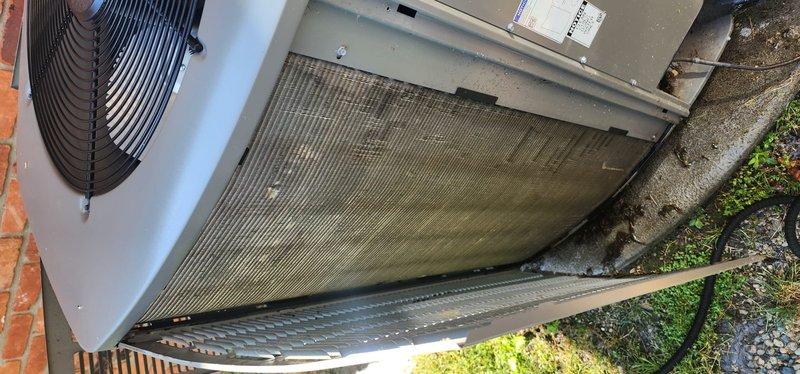 Completed scheduled maintenance tune-up on residential cooling system. Performed comprehensive inspection of outdoor condensing unit and air handler, documenting significant dirt and debris accumulation on condenser coil fins requiring attention. System confirmed operational at time of service with all components functioning properly.