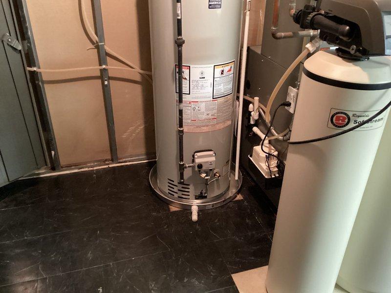Successfully installed a 40-gallon tanked water heater in the utility room. Removed existing unit and positioned new water heater adjacent to the water softener system. Connected copper supply lines to the top of the unit, ensuring proper hot and cold water connections with appropriate shutoff valves. Installed temperature and pressure relief valve with discharge piping per code requirements. Verified all connections for leaks, tested unit operation, and confirmed proper heating functionality before completion.