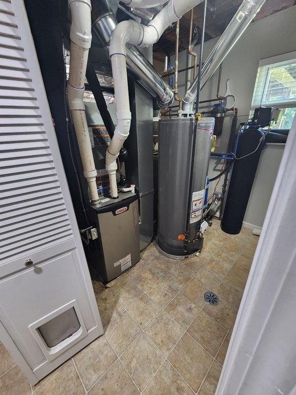 Completed full HVAC system installation including Lennox furnace, air conditioning unit, whole-home humidifier, and S40 smart thermostat. Installed new PVC venting system routed through ceiling joists with proper pitch and support, ensuring code-compliant exhaust and intake air pathways. Configured and programmed S40 thermostat for optimal system communication and efficiency settings. All equipment tested and operational upon completion.