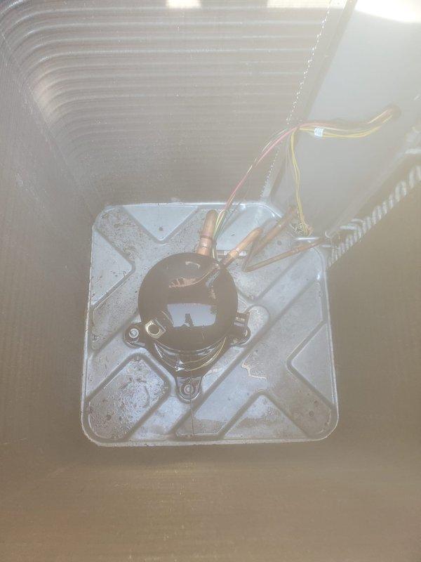 Completed comprehensive AC maintenance and tune-up on residential split system under preventive maintenance plan. Inspected evaporator coil assembly and condensate drain pan with pump in attic space, verified proper drainage operation and electrical connections. Serviced outdoor condenser unit, applied protective covering, and confirmed system operational efficiency meets manufacturer specifications.
