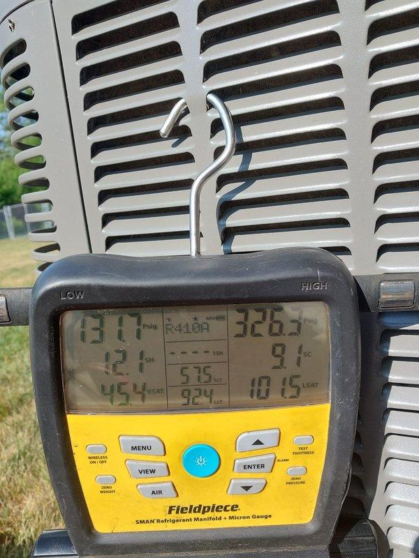 Completed routine air conditioning maintenance on residential cooling system. Performed system diagnostics using digital manifold gauge, recording operating pressures and temperatures to verify proper refrigerant charge and system performance. Inspected outdoor condenser unit, including heat exchanger coils and ventilation components. All readings within manufacturer specifications. System operating efficiently with no deficiencies noted.