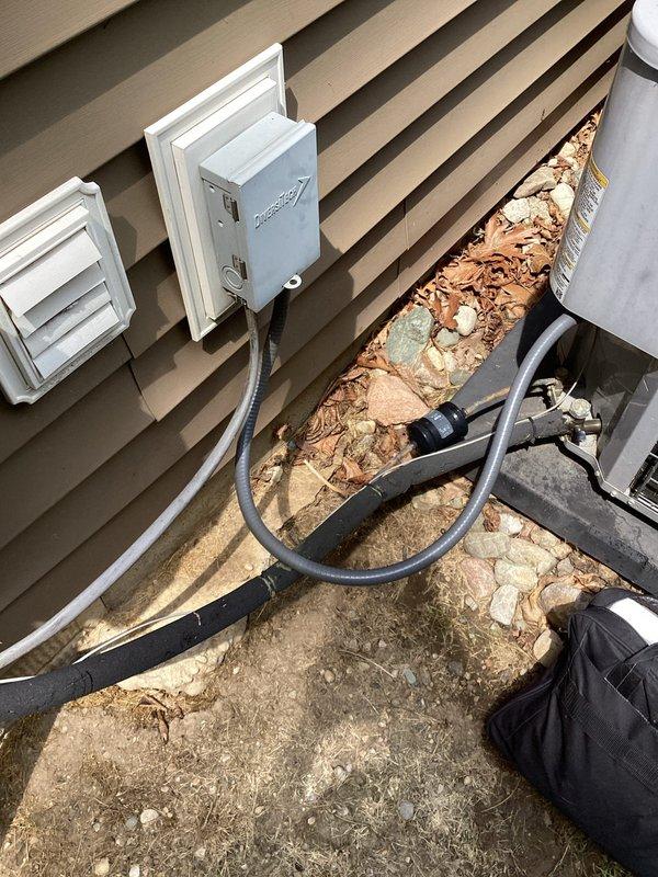 Provided estimate for replacement of 12-year-old air conditioning system currently located at exterior of home with condenser positioned on ground-level pad adjacent to building. Existing unit operational but evaluated for replacement due to age and efficiency considerations. Assessment included review of outdoor condenser unit with electrical disconnect, refrigerant lines, and basement-level air handler or evaporator coil connected to existing ductwork system.