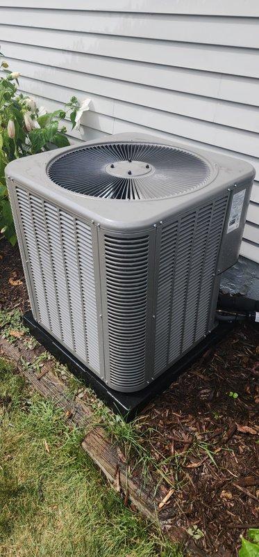 Completed comprehensive cooling season maintenance on residential outdoor air conditioning condenser unit per Worry Free Service Agreement protocol. Performed standard AC maintenance 3-5 checklist including visual inspection of unit exterior, verification of proper installation on base pad, assessment of cabinet condition and louver airflow clearances, and documentation of equipment status. Unit found operating within normal parameters with adequate clearances from surrounding vegetation and proper elevation on mounting pad.