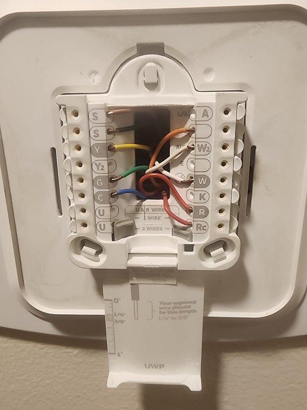 Responded to no cooling complaint on 11-year-old air conditioning system. Upon arrival, verified unit was blowing warm air with no cooling capacity. Performed diagnostic testing using refrigerant manifold and micron gauge to assess system pressures and temperatures. Checked thermostat wiring connections and verified proper terminal connections for all low-voltage wires including compressor, fan, and common circuits. Identified system performance issues consistent with age-related wear on outdoor unit components. Advised customer of need for Lennox Media Filter Merv 16 (X6672, X6675) replacement to maintain proper airflow and system efficiency.