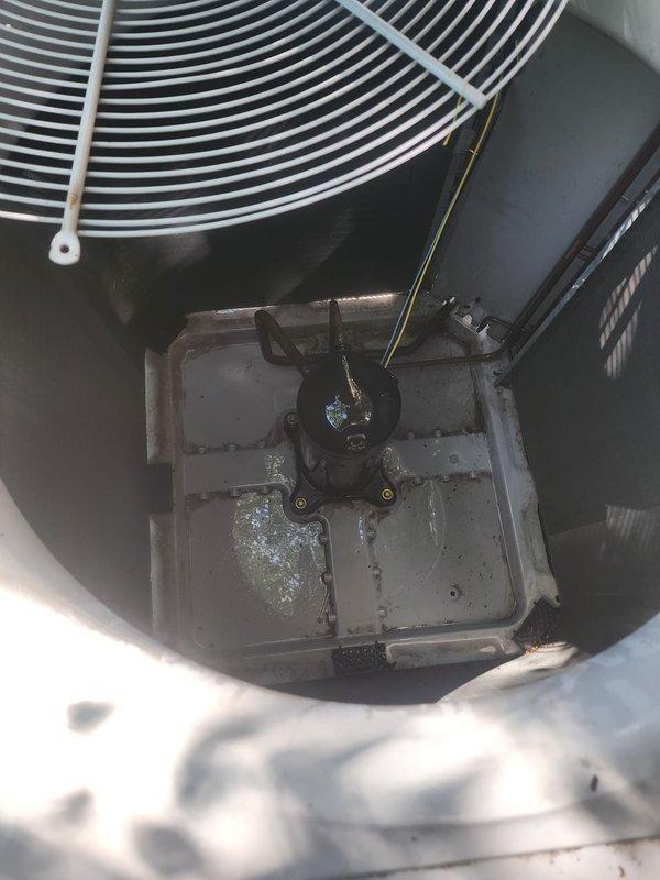 Completed annual HVAC maintenance tune-up on residential cooling system. Inspected outdoor condenser unit and verified system operational status. Checked refrigerant levels following previous year's service where refrigerant and UV dye were added to identify potential leak. Confirmed refrigerant charge within manufacturer specifications with no evidence of leakage detected. Performed comprehensive preventive maintenance including inspection of condenser coil, fan motor operation, electrical connections, and overall unit condition. System tested and operating properly with no issues found.