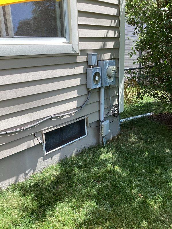 Conducted comprehensive assessment of 21-year-old residential HVAC system for full replacement estimate. Evaluated existing furnace located in basement utility area and outdoor air conditioning condenser unit mounted on exterior wall with vinyl siding. Inspected current equipment operation, ductwork configuration, electrical service connections, gas line routing, and condensate drainage systems. Documented equipment specifications, measured installation clearances, photographed existing system components and exterior mounting locations. Assessed structural considerations for new equipment placement including floor space, ventilation requirements, and utility meter proximity. Provided homeowner with detailed replacement options for matched furnace and air conditioning system to address equipment age and improve energy efficiency.