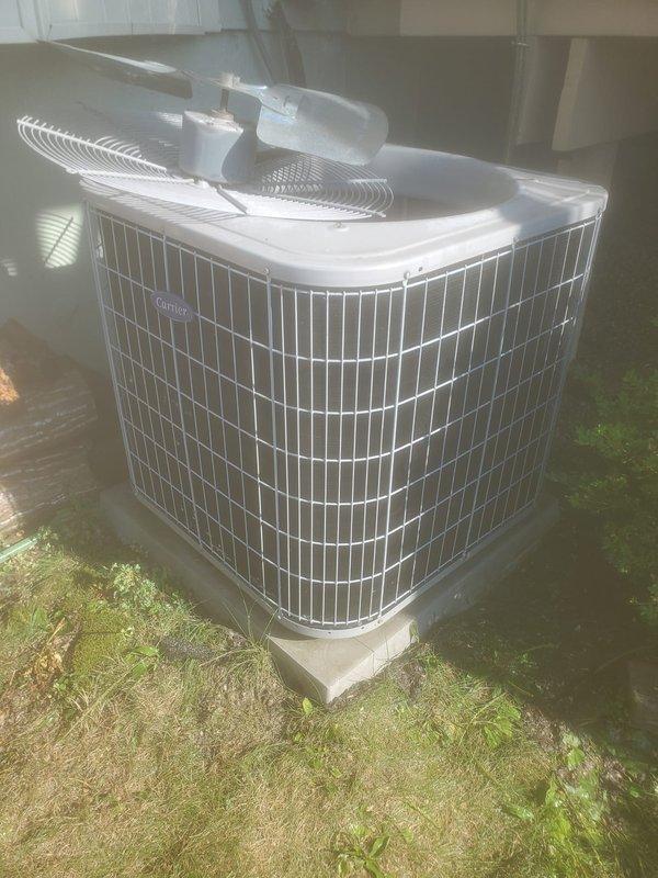Performed preventative maintenance on Carrier 5-7 ton outdoor condensing unit. Inspected condenser coil, fan assembly, and refrigerant lines for proper operation. Verified condensate drain pan and drainage system functioning correctly with clear discharge line. Unit operating within normal parameters upon completion of tune-up.