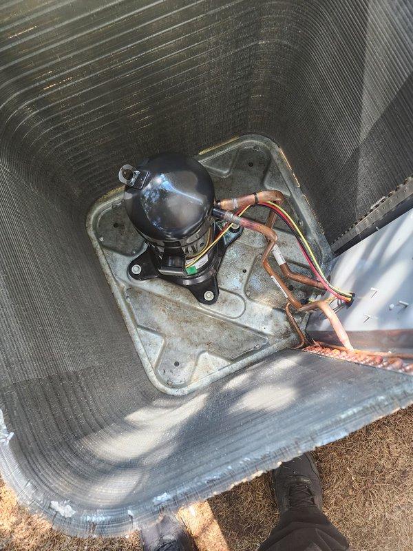 Completed comprehensive cooling season maintenance on residential air conditioning system located in garage/laundry room area. Performed thorough inspection of outdoor condenser unit including examination of compressor, refrigerant lines, heat exchanger coils, and electrical connections; all components found in operational condition with proper copper line connections and secure wiring. System tested and verified ready for cooling season operation.