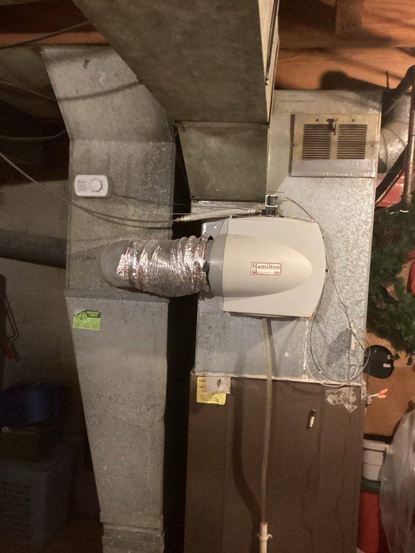 Conducted comprehensive estimate for HVAC system replacement, evaluating existing furnace and air conditioning equipment in residential basement mechanical room. Assessed current brown cabinet furnace unit with Hamilton humidifier attachment, silver flexible ductwork, and metal plenum system to provide replacement options, with customer potentially proceeding with furnace replacement only at this time.