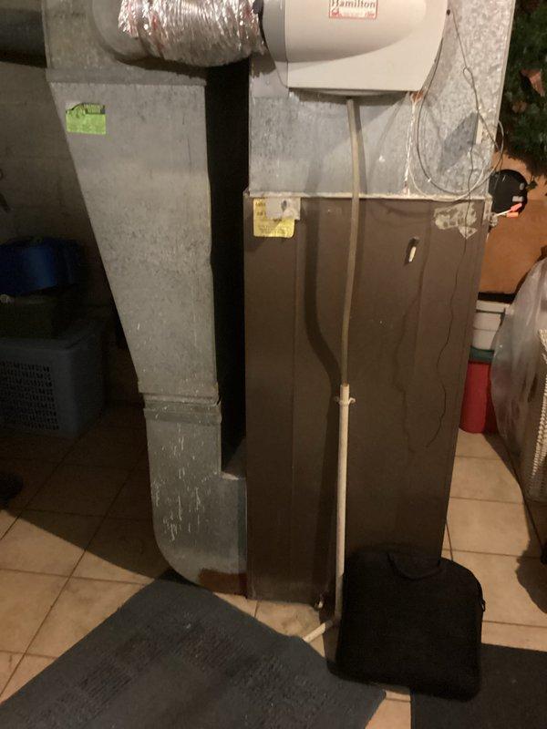 Conducted comprehensive estimate for HVAC system replacement, evaluating existing furnace and air conditioning equipment in residential basement mechanical room. Assessed current brown cabinet furnace unit with Hamilton humidifier attachment, silver flexible ductwork, and metal plenum system to provide replacement options, with customer potentially proceeding with furnace replacement only at this time.