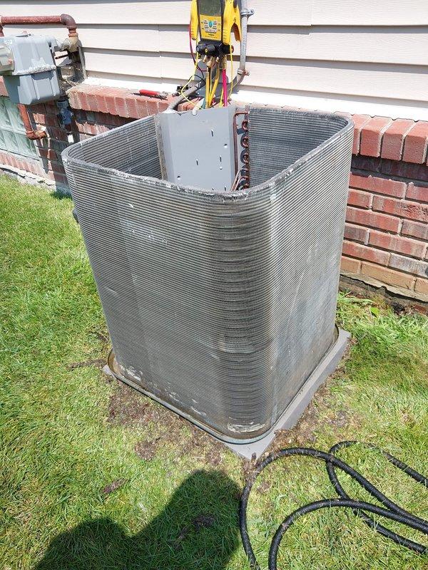 Responded to service call for water accumulation beneath outdoor condensing unit. Upon inspection, identified ice buildup on evaporator coil causing excessive condensate drainage. Advised customer to allow system to thaw completely between 11AM-3PM before resuming operation. Performed visual inspection of refrigerant lines, electrical connections, and ductwork penetration. Documented unit condition with diagnostic equipment and confirmed proper installation of disconnect box and line set routing.