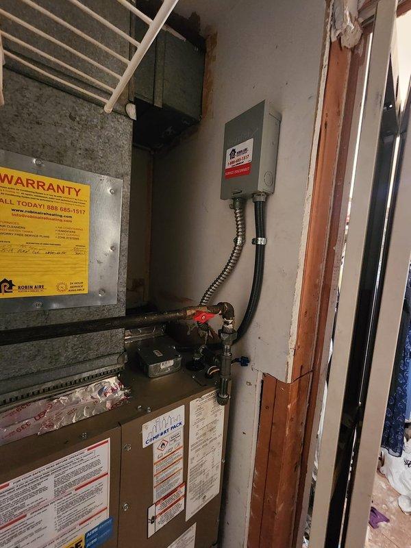 Installed National Comfort Products package unit in residential utility room, including all necessary electrical connections, refrigerant lines, and condensate drainage. System was tested and verified operational upon completion, with all components properly secured and labeled per manufacturer specifications.