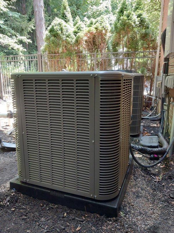 Responded to callback regarding unlevel outdoor condensing unit. Upon arrival, accessed property using provided gate code. Inspected Lennox AC condenser positioned on plastic base pad against brick exterior wall. Unit was slightly unlevel as reported. Verified condenser positioning and stability on pad. Documented equipment condition with photos showing unit placement, surrounding area, and refrigerant line connections. Equipment operational with no immediate safety concerns noted.