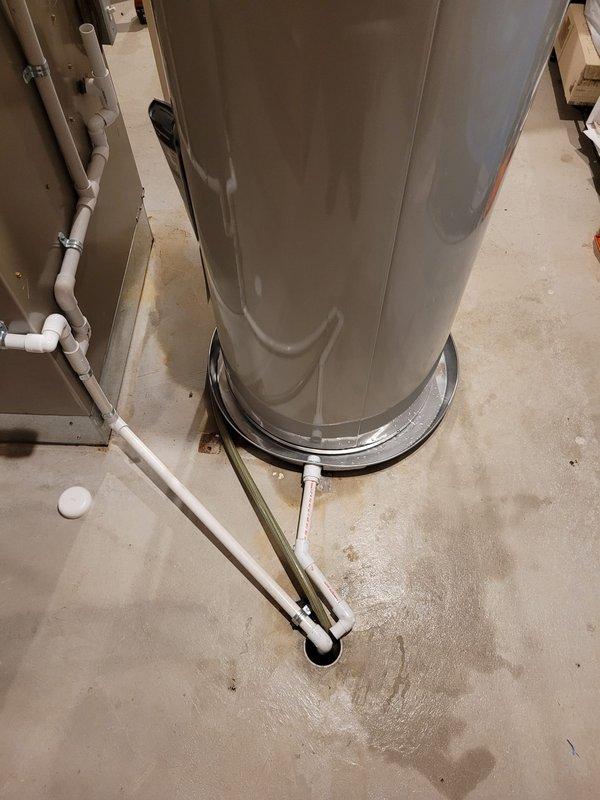 Successfully installed a new 50-gallon tanked water heater in the basement utility room. Positioned the unit on the concrete floor and completed all necessary water supply connections using copper piping. Installed and properly suspended a blue expansion tank from the ceiling joists to protect the system from thermal expansion. Connected all hot and cold water lines with appropriate shutoff valves and applied foam insulation to designated piping sections. Ensured proper venting configuration and verified all connections for leaks. System was tested, filled, and confirmed operational with no issues detected.