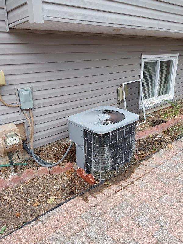 Responded to no cooling call on 25-year-old air conditioning system located on south side of residence. Upon arrival, performed diagnostic evaluation of outdoor condensing unit. Identified failed dual run capacitor as primary cause of system failure. Capacitor showed visible signs of deterioration, age-related wear, and complete loss of capacitance. Removed defective capacitor and installed new replacement unit with proper microfarad rating for compressor and condenser fan motor. Verified all electrical connections were secure at capacitor terminals and contactor. Restored power to system and confirmed compressor and outdoor fan motor started properly. Monitored system operation through complete cooling cycle. Verified proper amperage draw on compressor and fan motor. Confirmed cold air delivery at indoor registers and proper temperature split across evaporator coil. System restored to full operational status. Given the advanced age of the equipment, advised customer that additional co