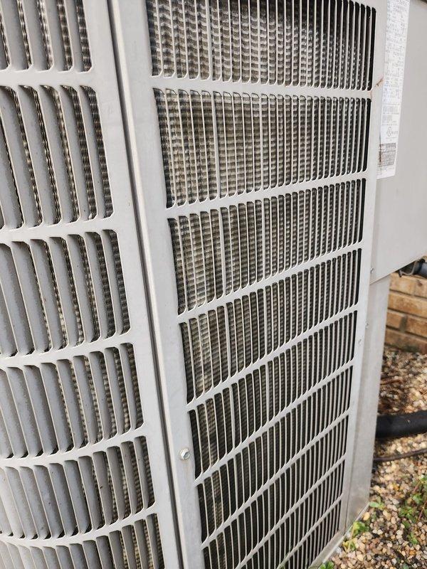 Completed comprehensive preventive maintenance on residential air conditioning system under prepaid service agreement. Performed standard AC tune-up protocol including inspection of outdoor condensing unit, compressor assembly, and refrigerant lines. Condenser coil fins showed moderate accumulation of dirt and debris, which is typical for outdoor units; cleaned coil surfaces to restore optimal heat transfer efficiency. Inspected compressor with copper refrigerant lines and verified proper connections. Checked condensate drain pan condition and vibration dampeners. All electrical connections and control wiring examined and found secure. System operational and ready for cooling season.