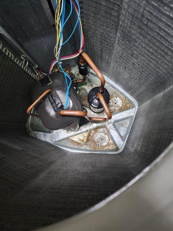 Completed preventive maintenance inspection on residential air conditioning system under Worry Free Service Agreement. Performed comprehensive evaluation of indoor evaporator coil assembly, condensate drain pan, and float switch operation, noting mineral deposits and water staining consistent with normal system operation. Inspected outdoor condenser unit, verified fan motor operation, and assessed overall system performance to ensure optimal cooling efficiency for the season.
