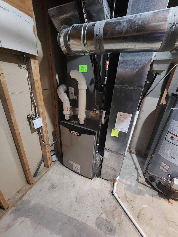 Completed installation of Lennox furnace system in basement mechanical room with all associated ductwork connections and PVC condensate drainage lines. Installed and configured Honeywell Mini-Zone control panel to manage system operation, verified all electrical connections, and confirmed proper system functionality per manufacturer specifications.
