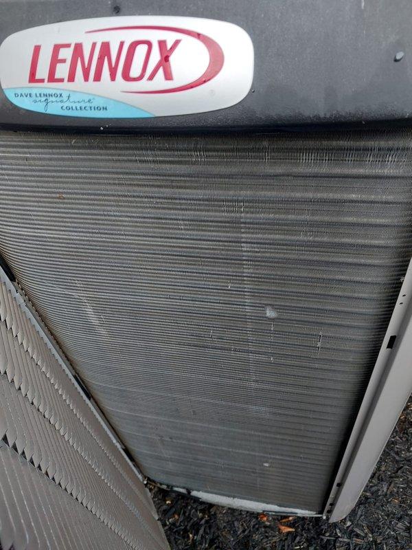 Completed scheduled maintenance tune-up on Lennox Dave Lennox Signature Collection cooling system. Performed comprehensive inspection of indoor evaporator coil and outdoor condensing unit, documenting conditions with photographs. System confirmed operational with normal refrigerant lines, electrical connections, and heat exchanger components functioning properly.
