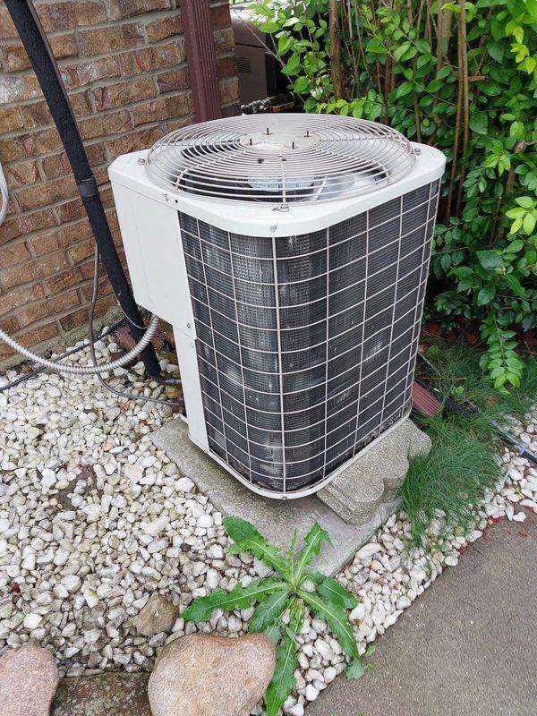 Completed routine cooling season maintenance on residential air conditioning system. Performed comprehensive inspection of outdoor condenser unit, verified proper operation of fan motor and compressor, and documented equipment condition with photographs showing unit in serviceable condition with adequate clearance and proper installation on concrete pad.