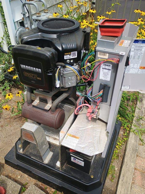 Performed routine preventive maintenance on residential standby generator equipped with Vanguard 627cc engine. Removed and replaced spark plugs showing normal wear patterns. Inspected air filtration system and noted mesh filter screen in serviceable condition. Verified electrical connections and control box wiring remained secure with no signs of deterioration or loose terminals. Confirmed generator mounting remained stable on concrete pad with all mechanical components properly secured. Unit tested successfully following maintenance procedures with all systems operating within normal parameters.