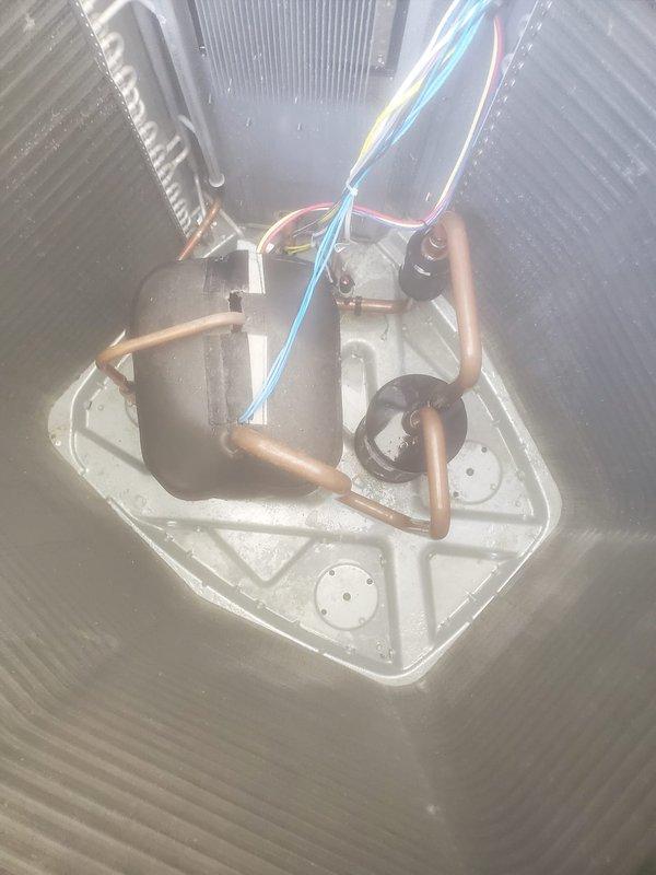 Completed routine AC maintenance inspection on residential split system. Inspected indoor evaporator coil assembly, condensate drain pan, refrigerant lines, and electrical connections in attic installation. Verified proper operation of outdoor condenser unit, checked airflow through protective grilles, and confirmed unit is level on concrete pad with adequate clearance from building.