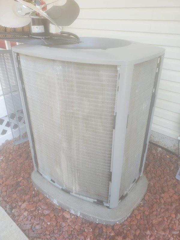 Completed routine AC maintenance inspection on residential split system. Inspected indoor evaporator coil assembly, condensate drain pan, refrigerant lines, and electrical connections in attic installation. Verified proper operation of outdoor condenser unit, checked airflow through protective grilles, and confirmed unit is level on concrete pad with adequate clearance from building.