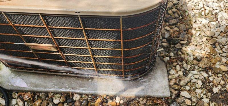 Completed routine air conditioning maintenance on residential outdoor condensing unit. Performed system inspection, removed and cleaned fan grille assembly, checked refrigerant levels, and verified proper operation of all components. Unit tested successfully with normal operating parameters confirmed upon completion.