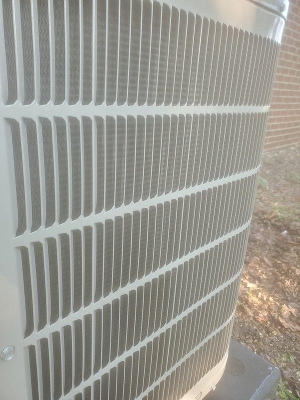 # HVAC Maintenance - Cooling System Service

Completed comprehensive preventive maintenance tune-up on residential cooling system. Upon arrival, verified system was operational and functioning properly per customer confirmation. Performed thorough inspection of outdoor condenser unit, which appeared clean and well-maintained with no visible signs of damage, excessive rust, or debris accumulation on exterior housing and louvered ventilation panels.

Inspected indoor air handler components located in attic space, including flexible ductwork, condensate drain pans, and associated plumbing. Noted presence of moisture in drain pans indicating normal condensate drainage during cooling operation. Observed some minor discoloration on drain pan surfaces consistent with typical usage. Verified proper drainage system function and checked all visible electrical connections and wiring.

Conducted standard tune-up procedures including cleaning, inspection of refrigerant lines, and verification of al