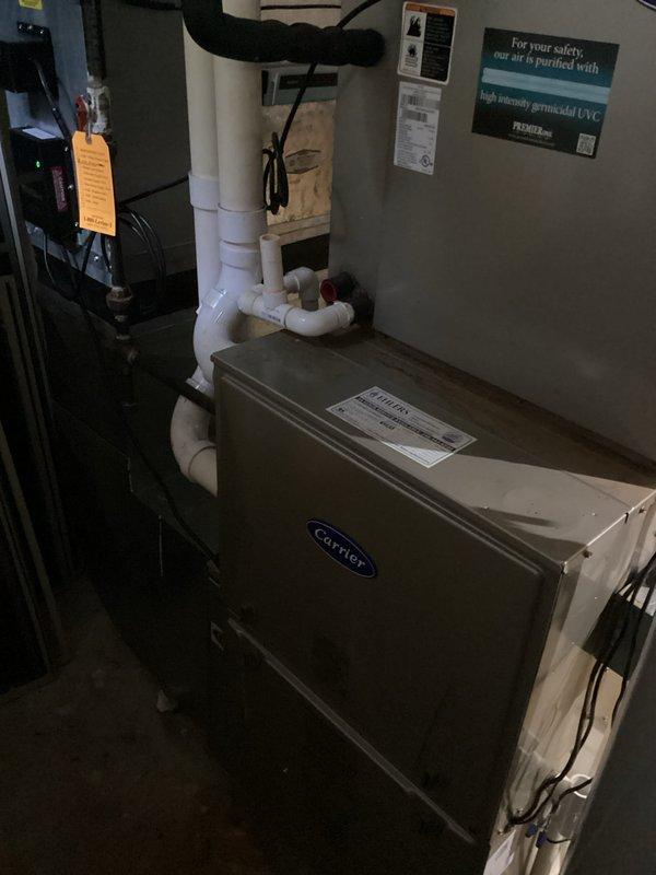 Conducted comprehensive estimate for residential air conditioning system with non-functional condenser coil experiencing refrigerant leak. Assessed existing Carrier HVAC equipment installation including air handler, furnace, and associated condensate drainage system to determine viability of component replacement versus full system replacement. Documented current equipment condition through photographic survey of mechanical room showing existing infrastructure, electrical disconnects, and PVC drainage lines. Provided homeowner with detailed options for either isolated condenser coil replacement or complete system upgrade based on equipment age, efficiency considerations, and long-term reliability factors.