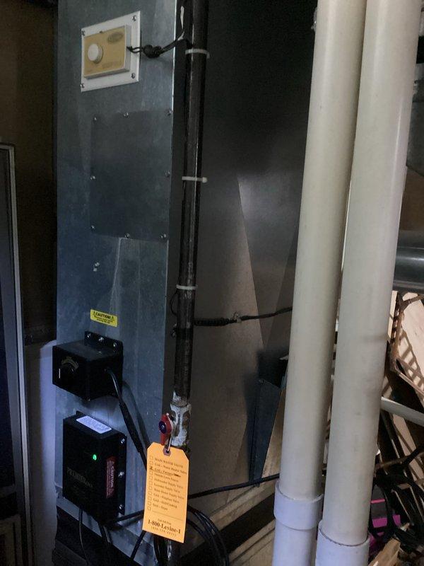 Conducted comprehensive estimate for residential air conditioning system with non-functional condenser coil experiencing refrigerant leak. Assessed existing Carrier HVAC equipment installation including air handler, furnace, and associated condensate drainage system to determine viability of component replacement versus full system replacement. Documented current equipment condition through photographic survey of mechanical room showing existing infrastructure, electrical disconnects, and PVC drainage lines. Provided homeowner with detailed options for either isolated condenser coil replacement or complete system upgrade based on equipment age, efficiency considerations, and long-term reliability factors.